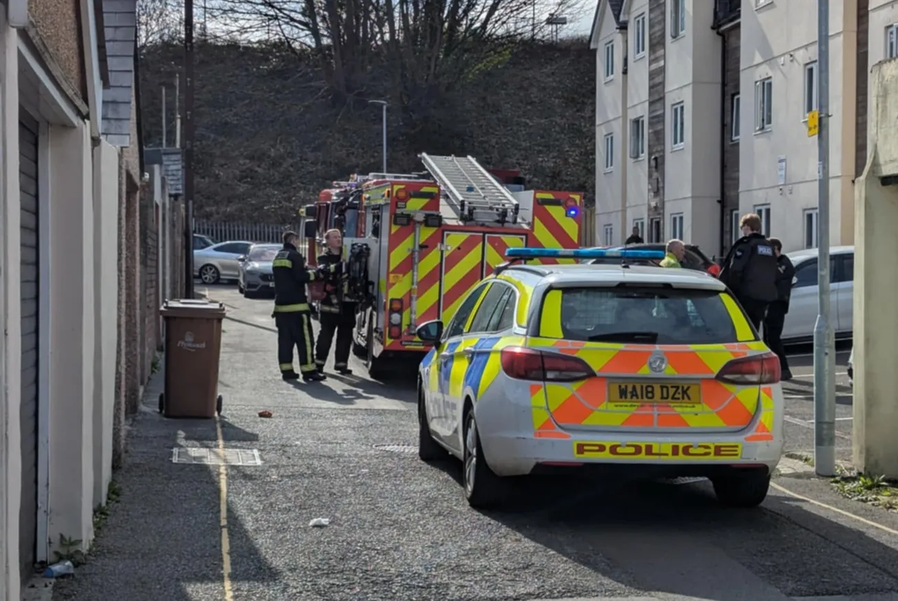 Police and firefighters rush to block of flats in Plymouth