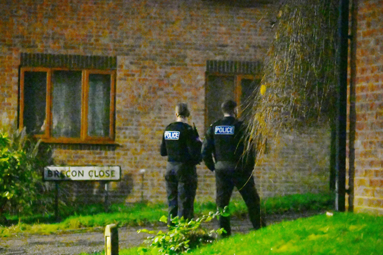 Emergency services descend on Plymouth street after woman climbs onto roof